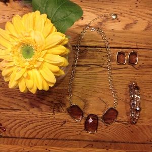 Matching necklace, bracelet and ear rings.